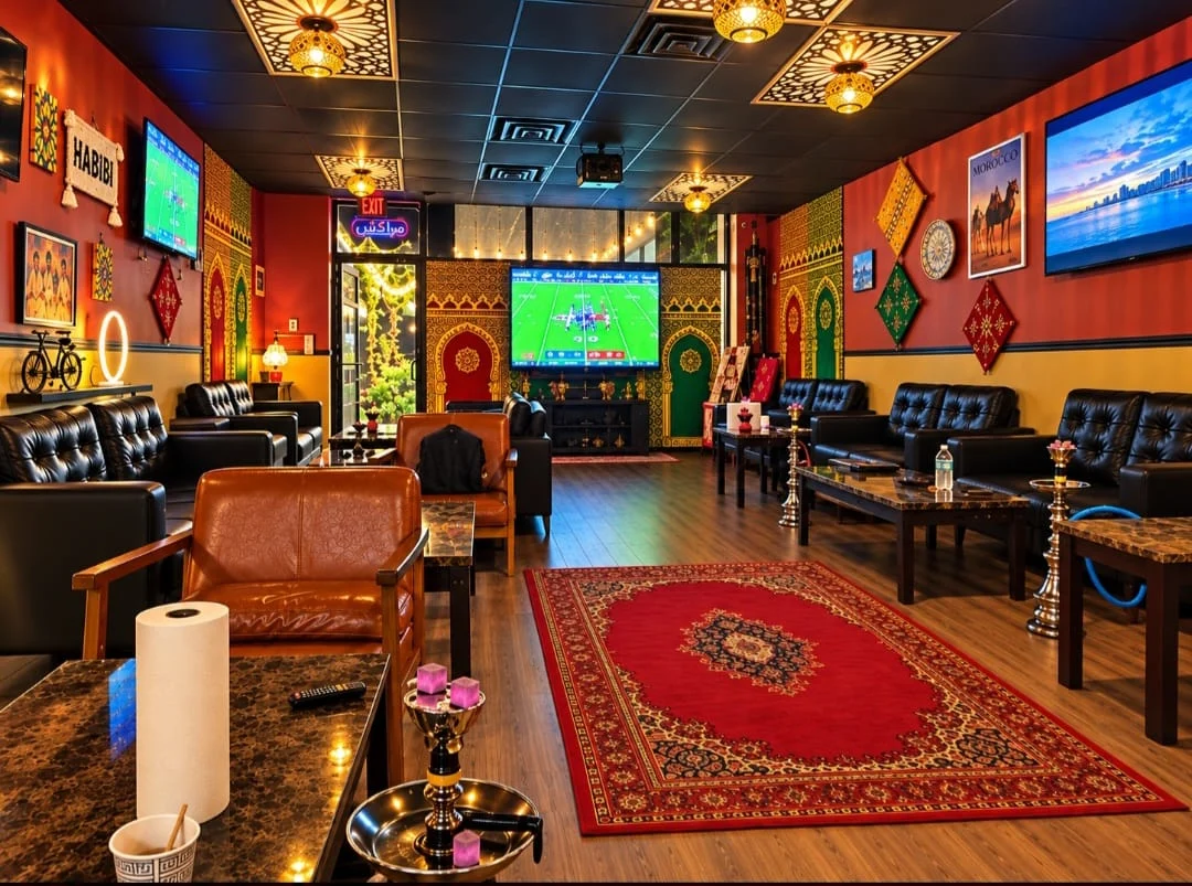 Lounge seating with red rugs and decorative lanterns